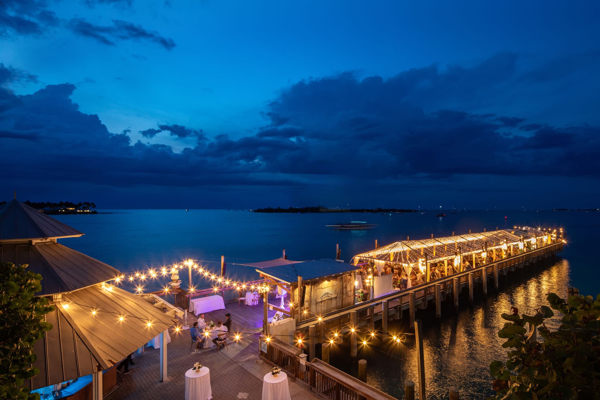 An event happening on the pier at Ocean Key in the evening all lit up