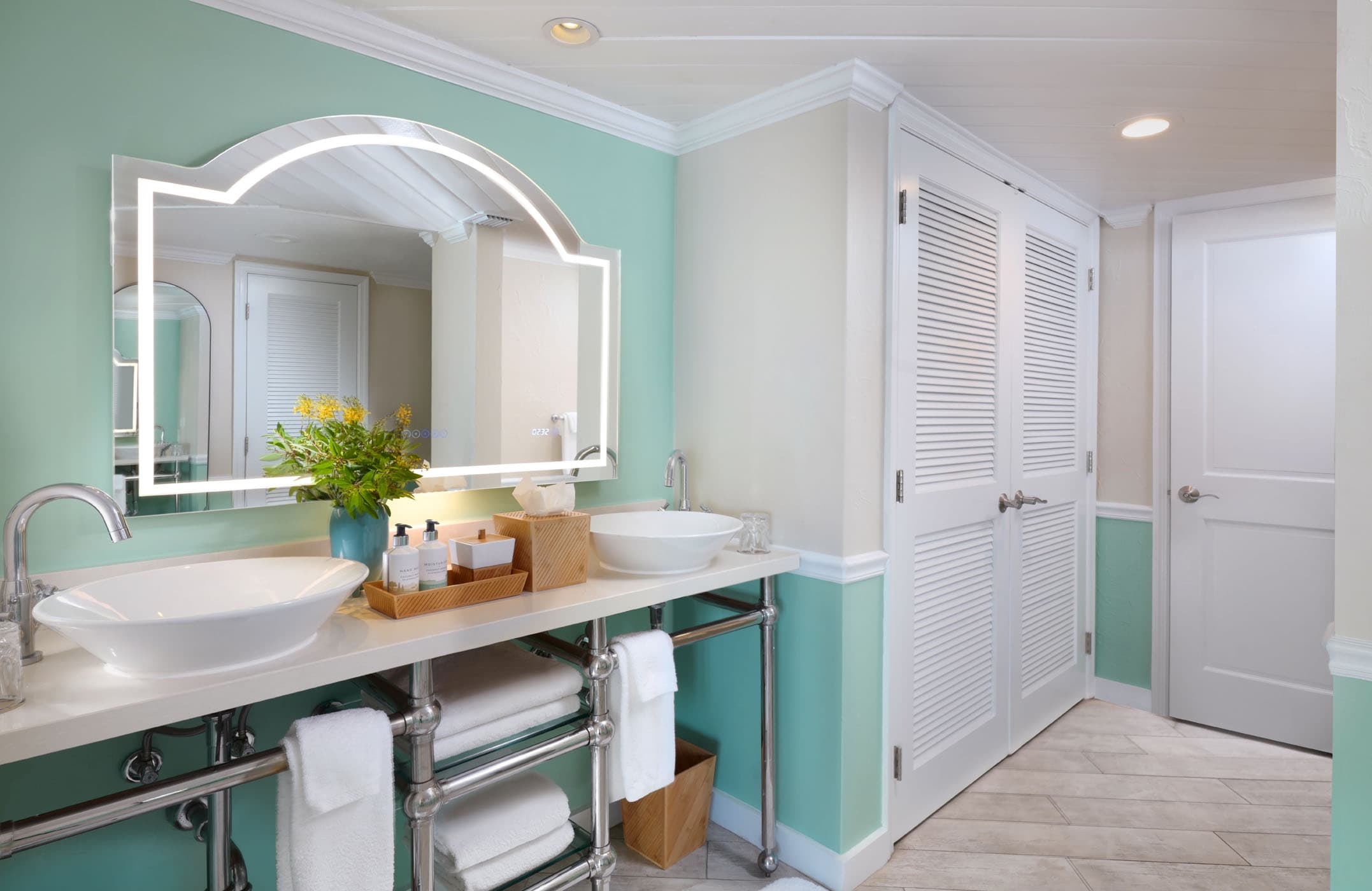 A double sink vanity with a closet in a washroom at Ocean Key