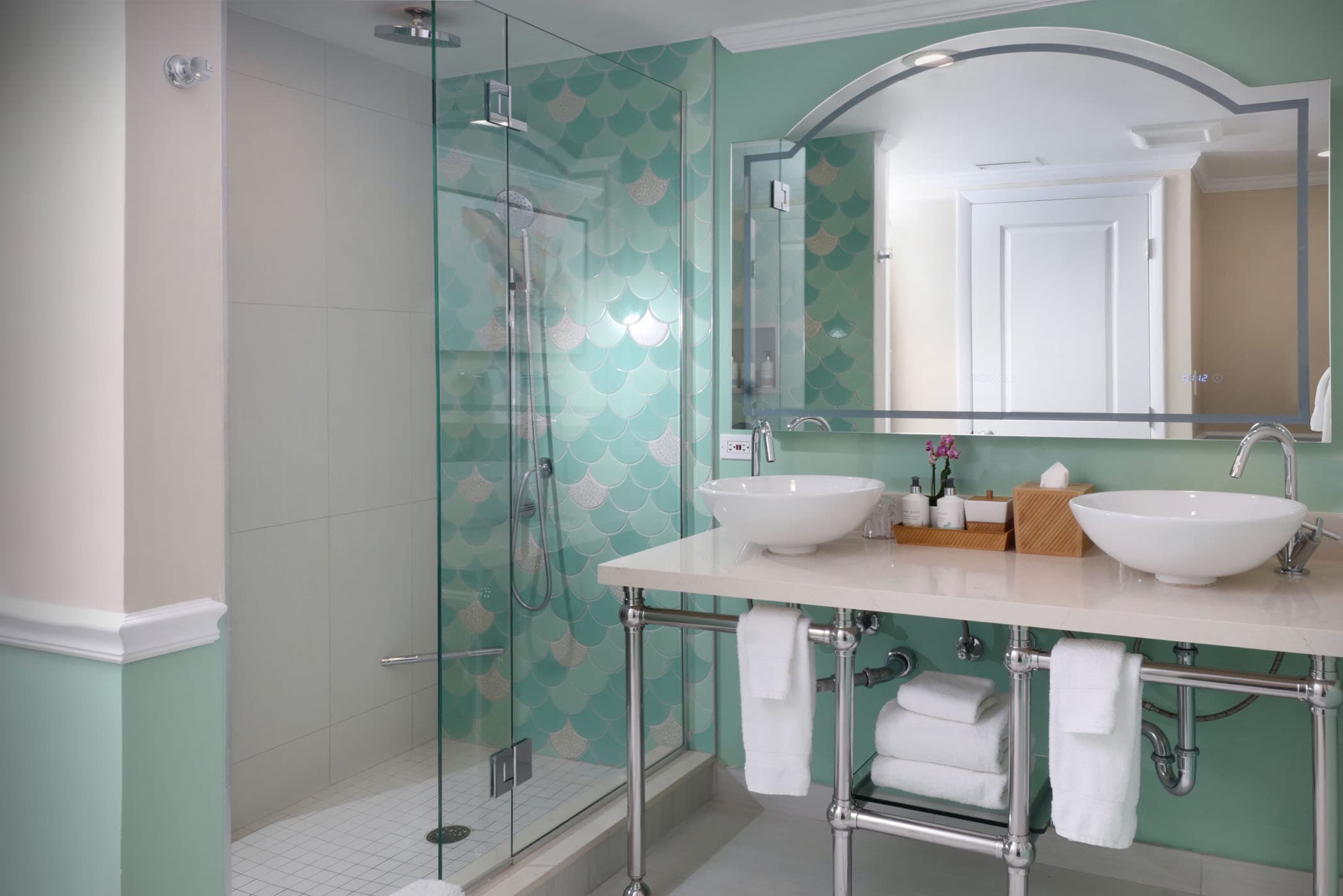 A double sink vanity and shower in a Junior Suite at Ocean Key