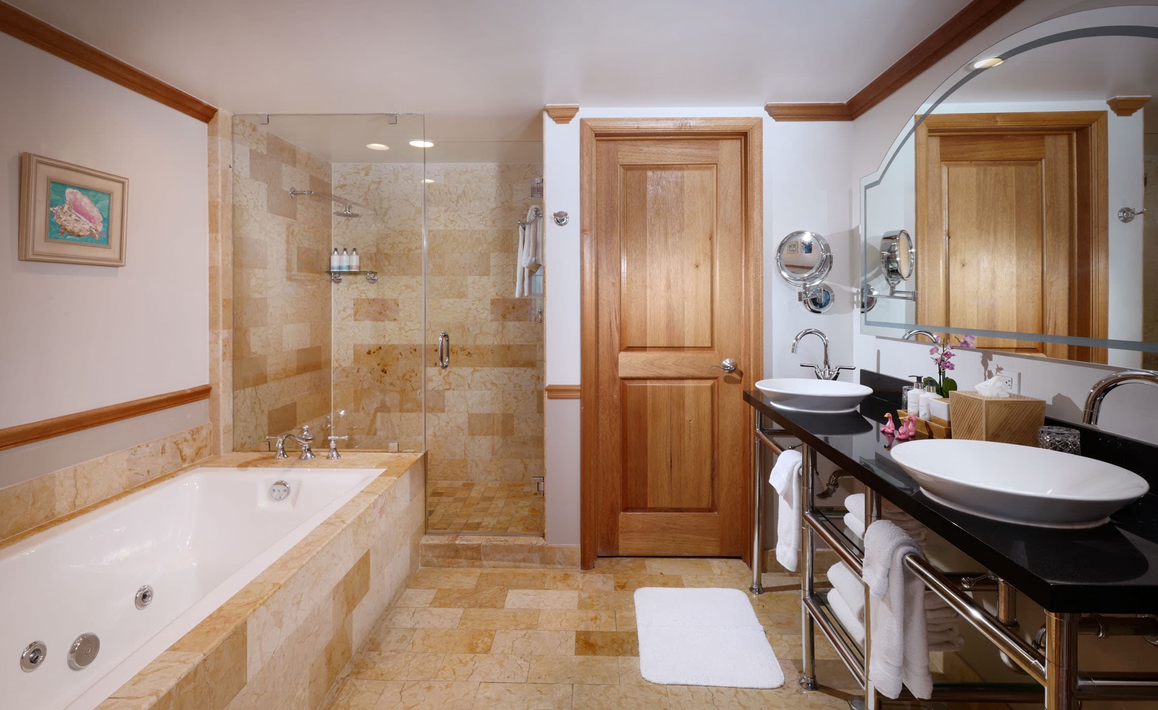 A large bathroom with a shower and a separate tub at Ocean Key