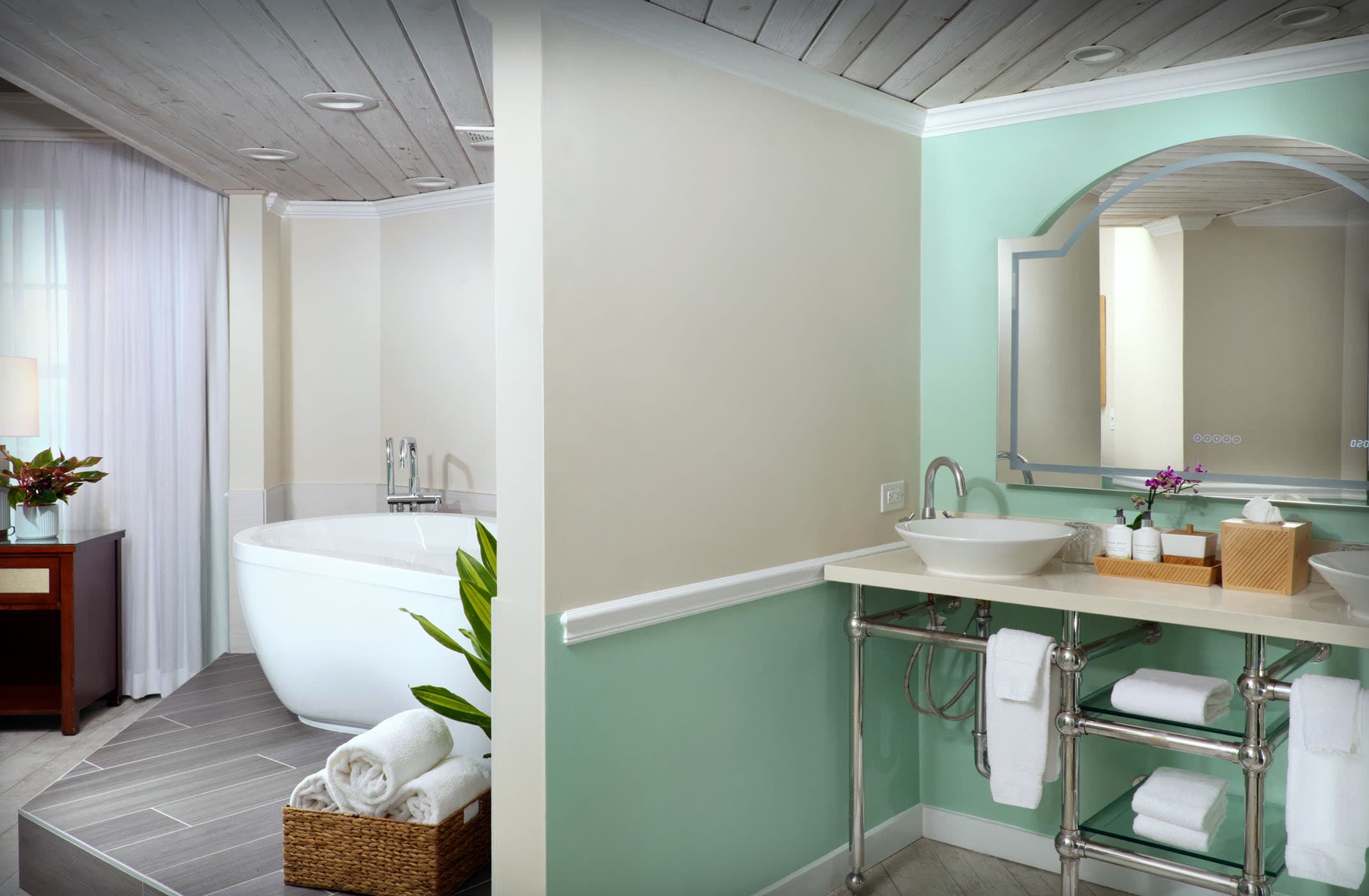The tub area with a separate sink area in a suite at Ocean Key