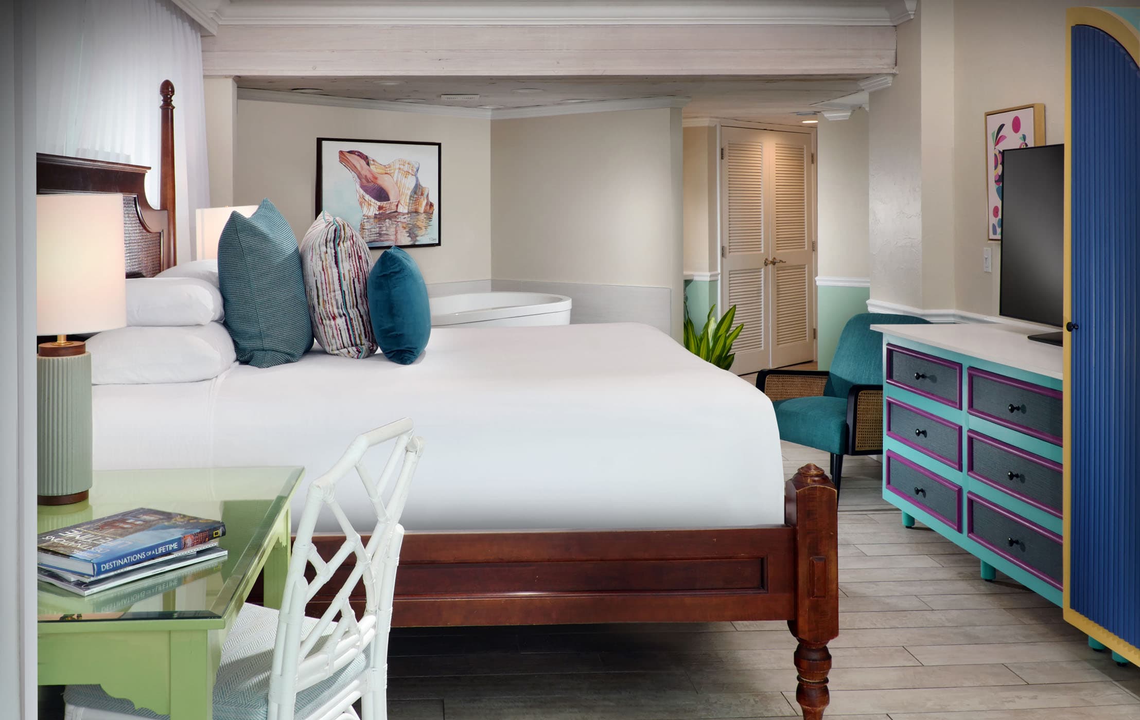 A king bed and a open tub area in a Deluxe Guestroom at Ocean Key