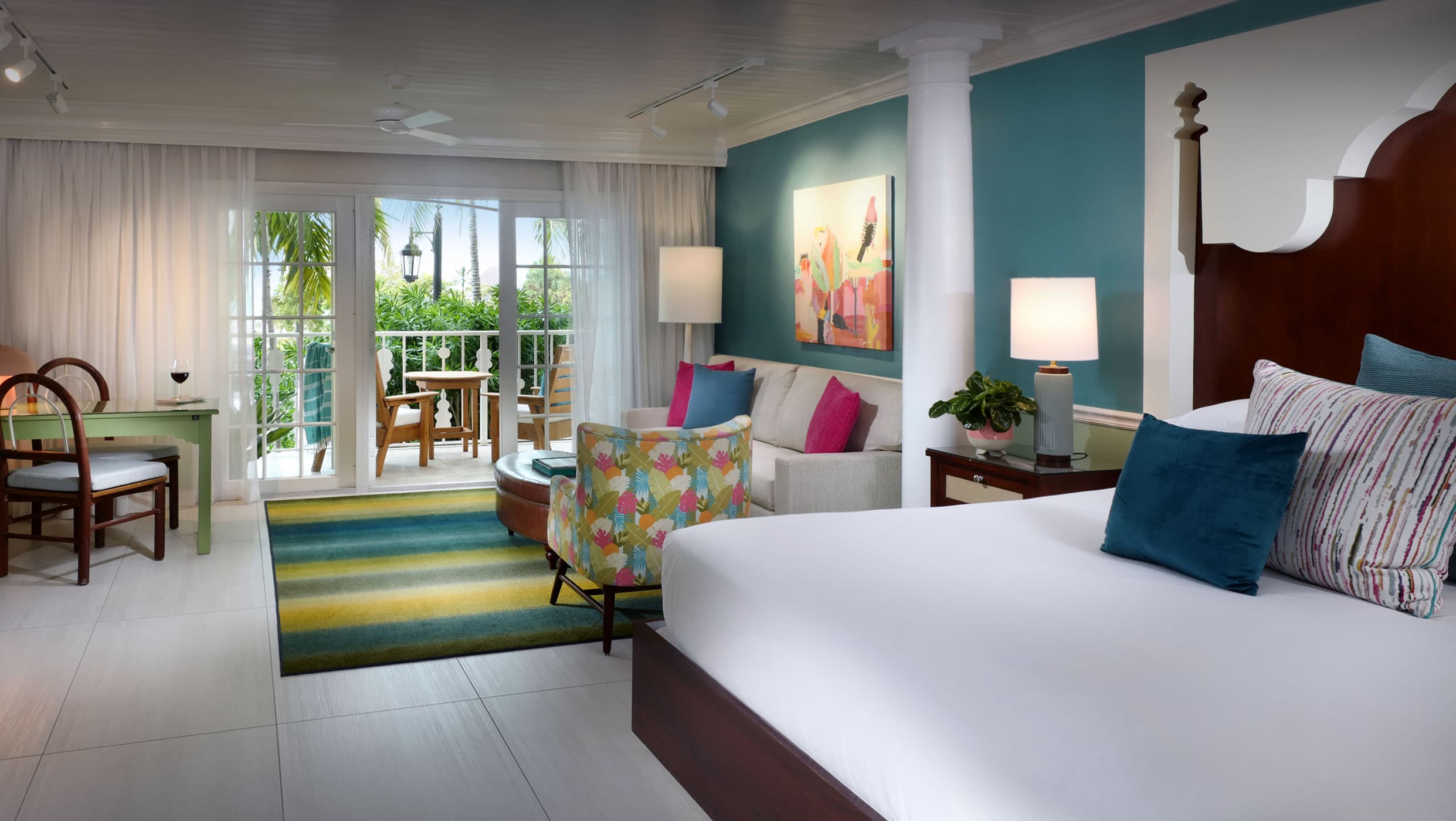An open concept junior Suite room with access to a balcony at Ocean Key