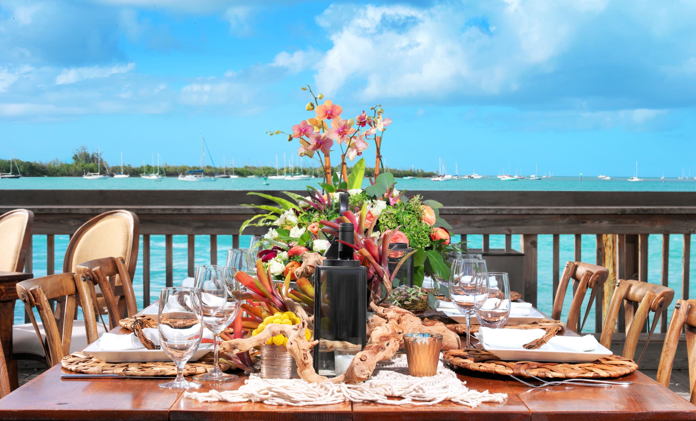 A beautiful and vibrant. centre piece on a table set up at a wedding at Ocean Key Resort