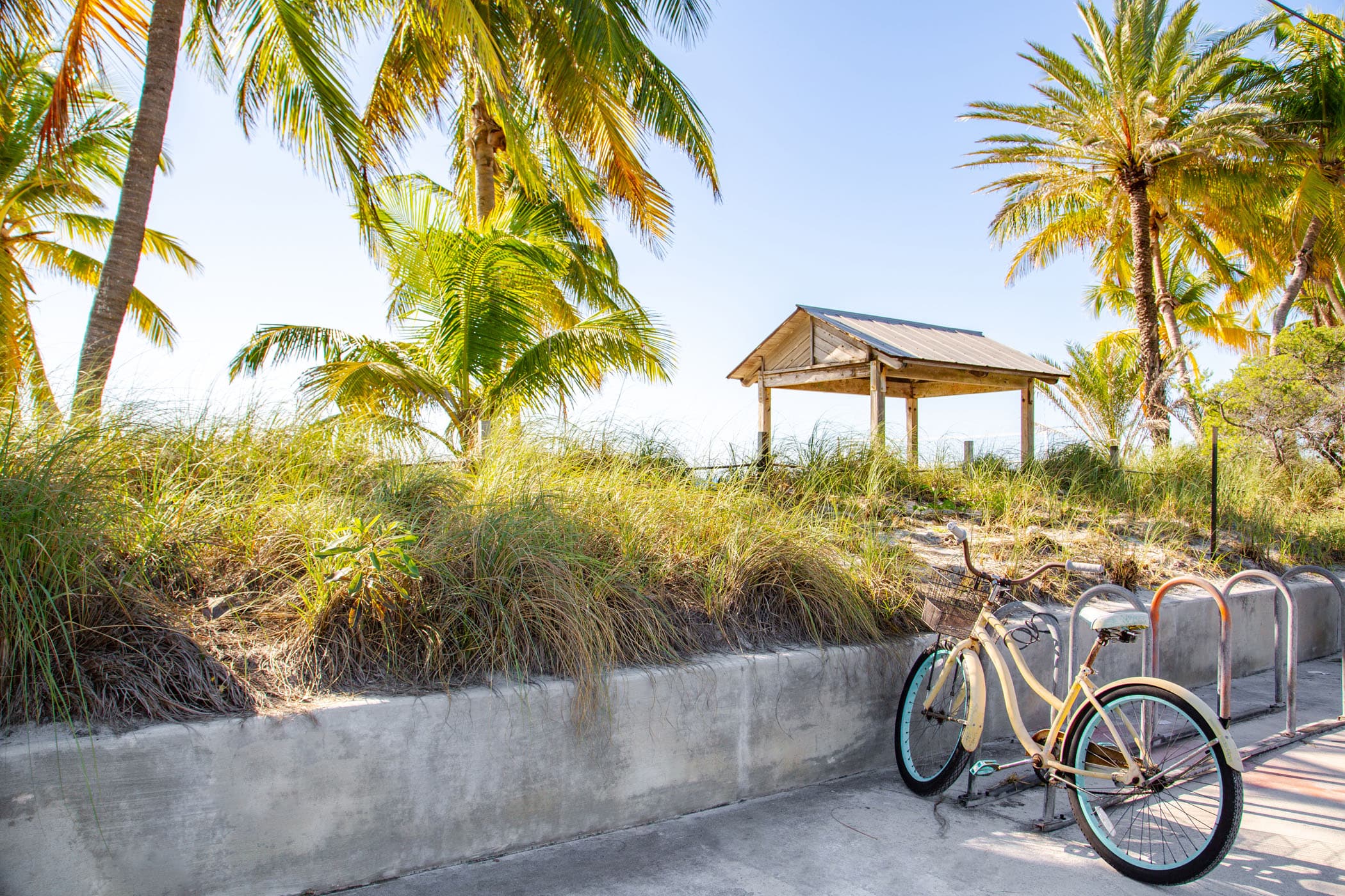 A bike parked at the entrance to a beach near Ocean Key Resort