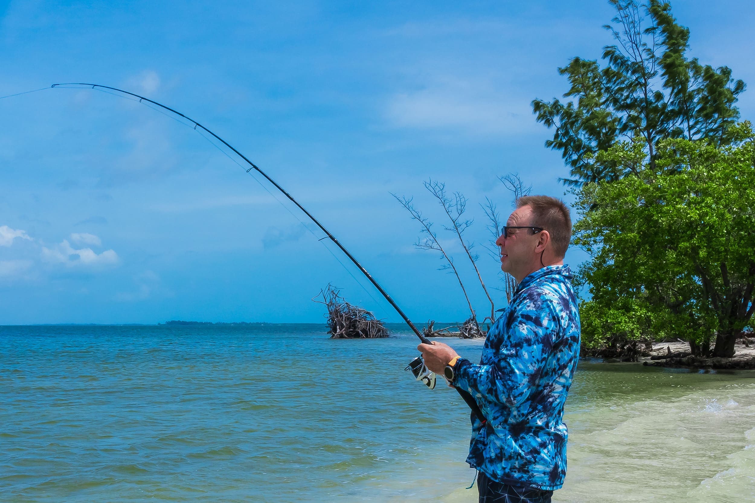 A man fishing on the beach