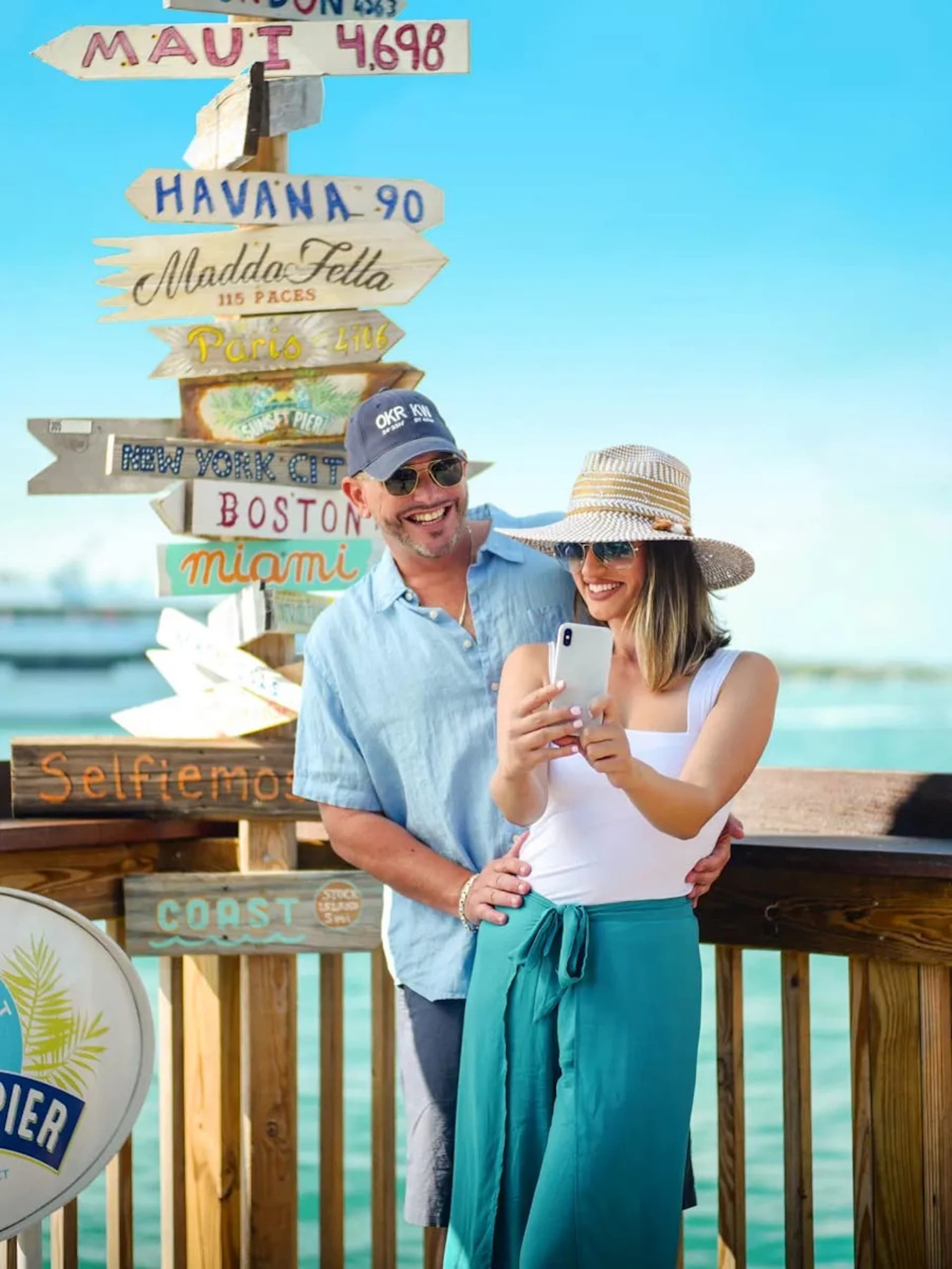 A couple taking a selfie at the pier