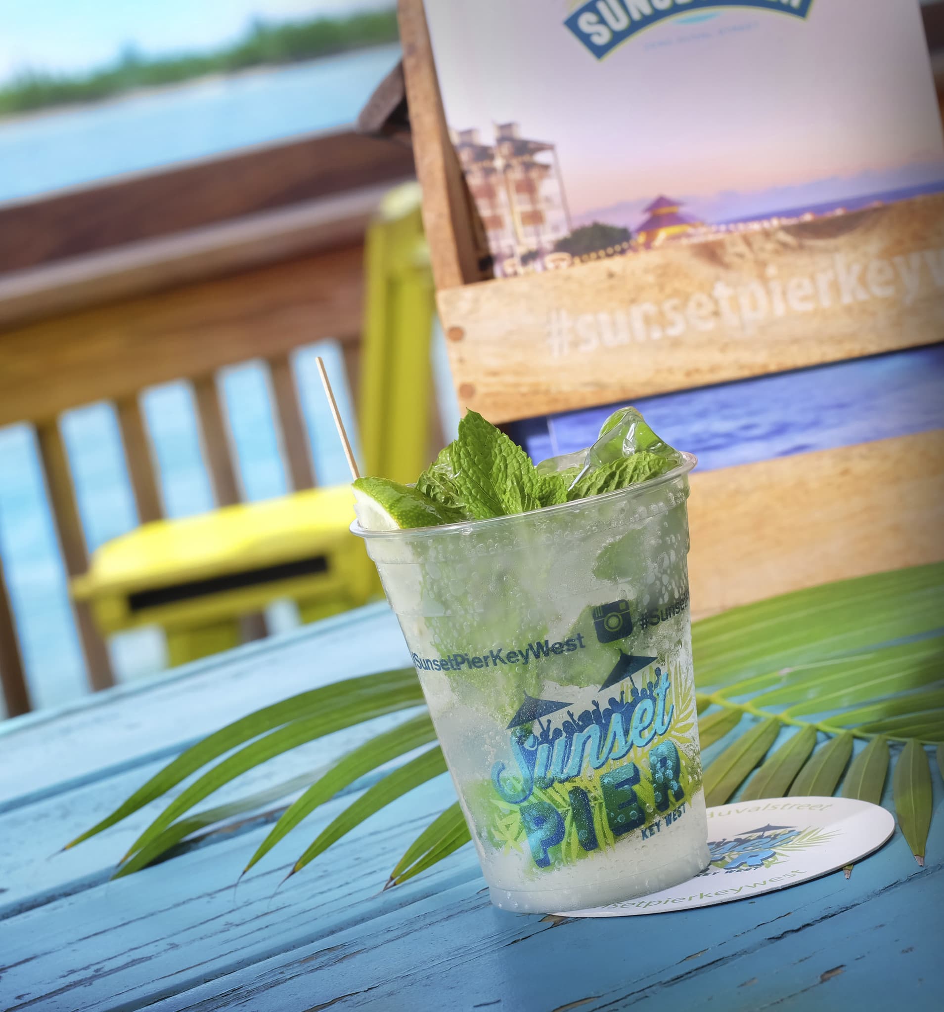 Mojito in a Sunset Pier cup on a blue table at Ocean Key Resort, Key West, Florida
