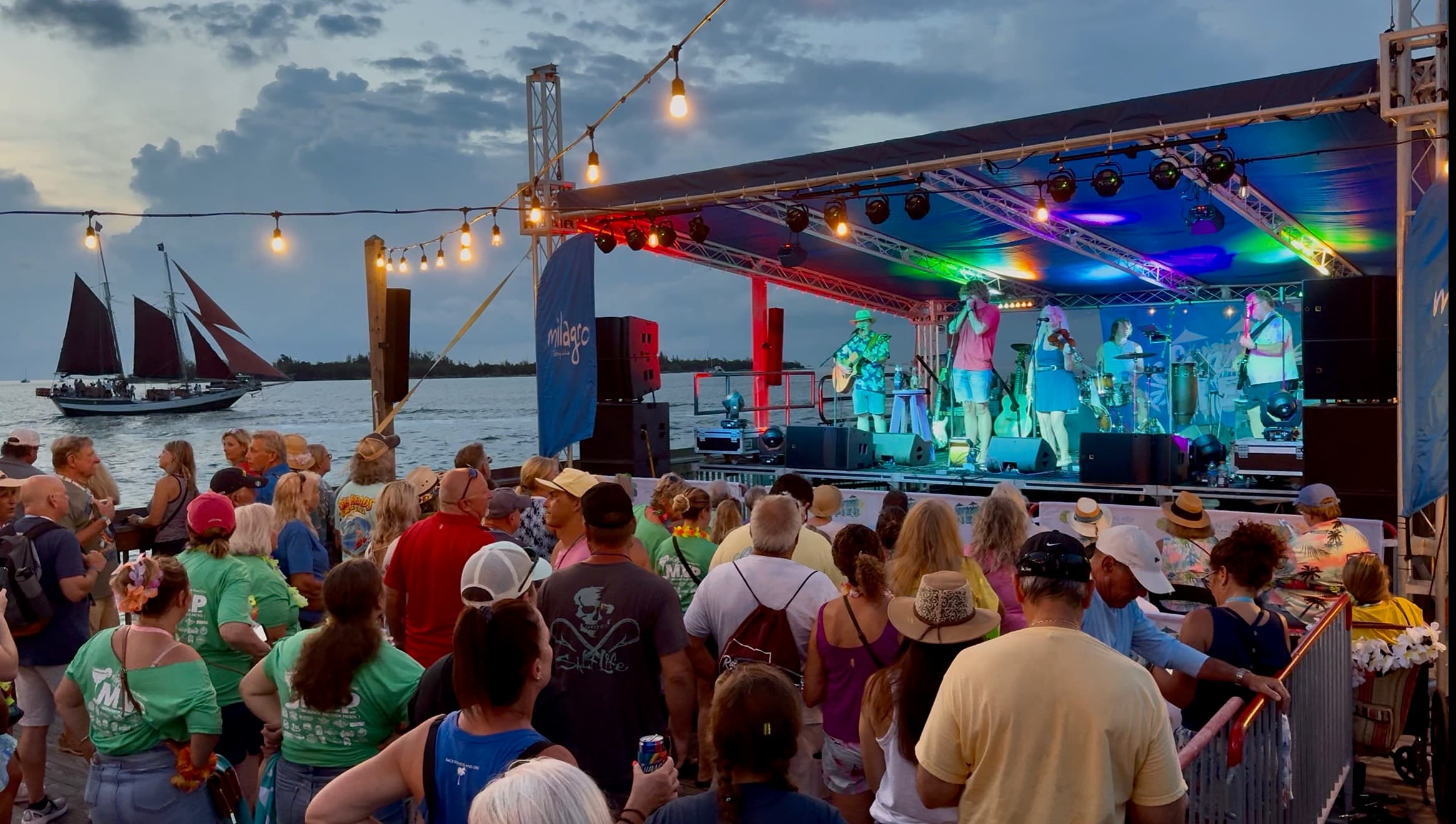 A band performing to a crowd at 0 Mile Fest