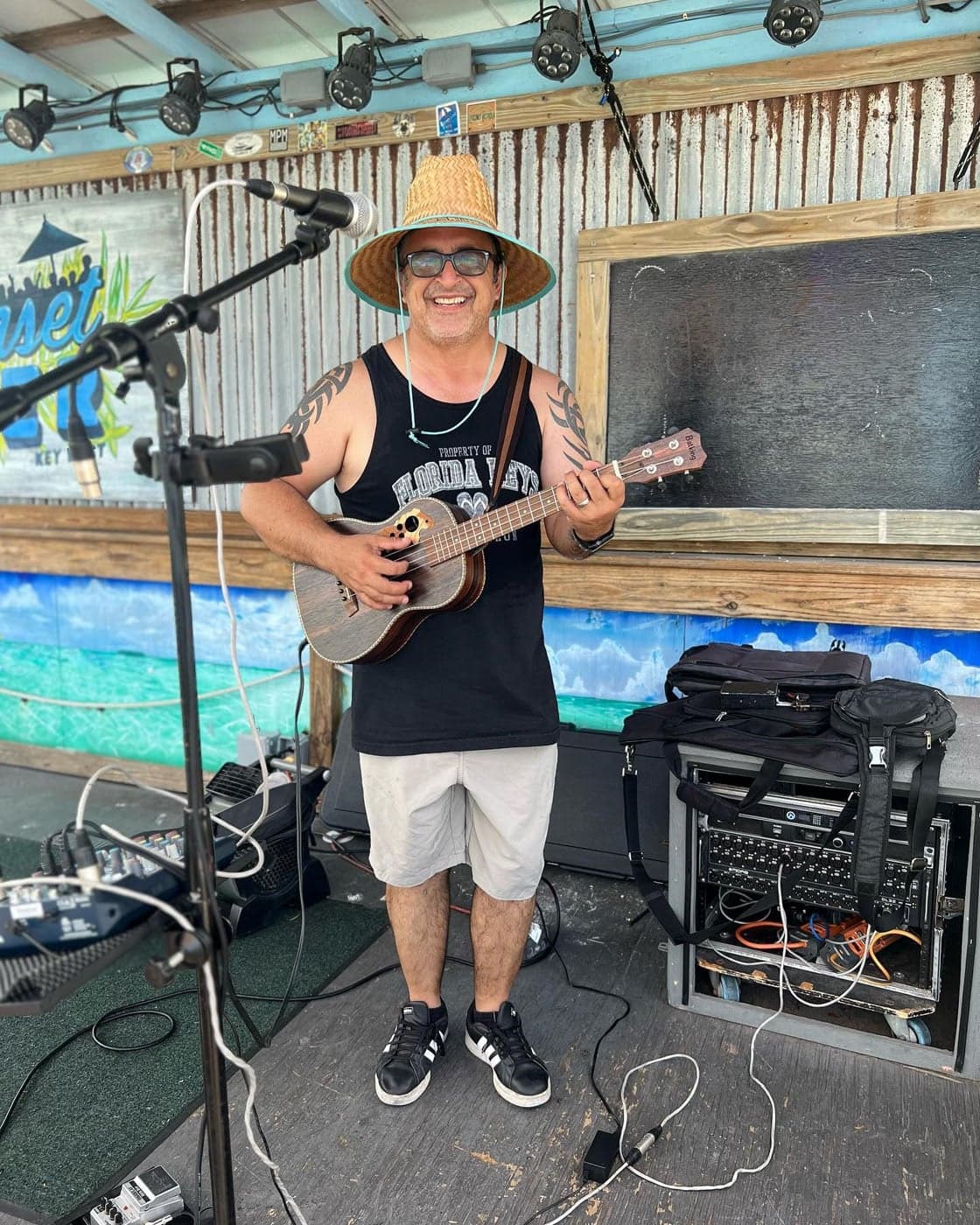 Rolando at Sunset Pier playing music