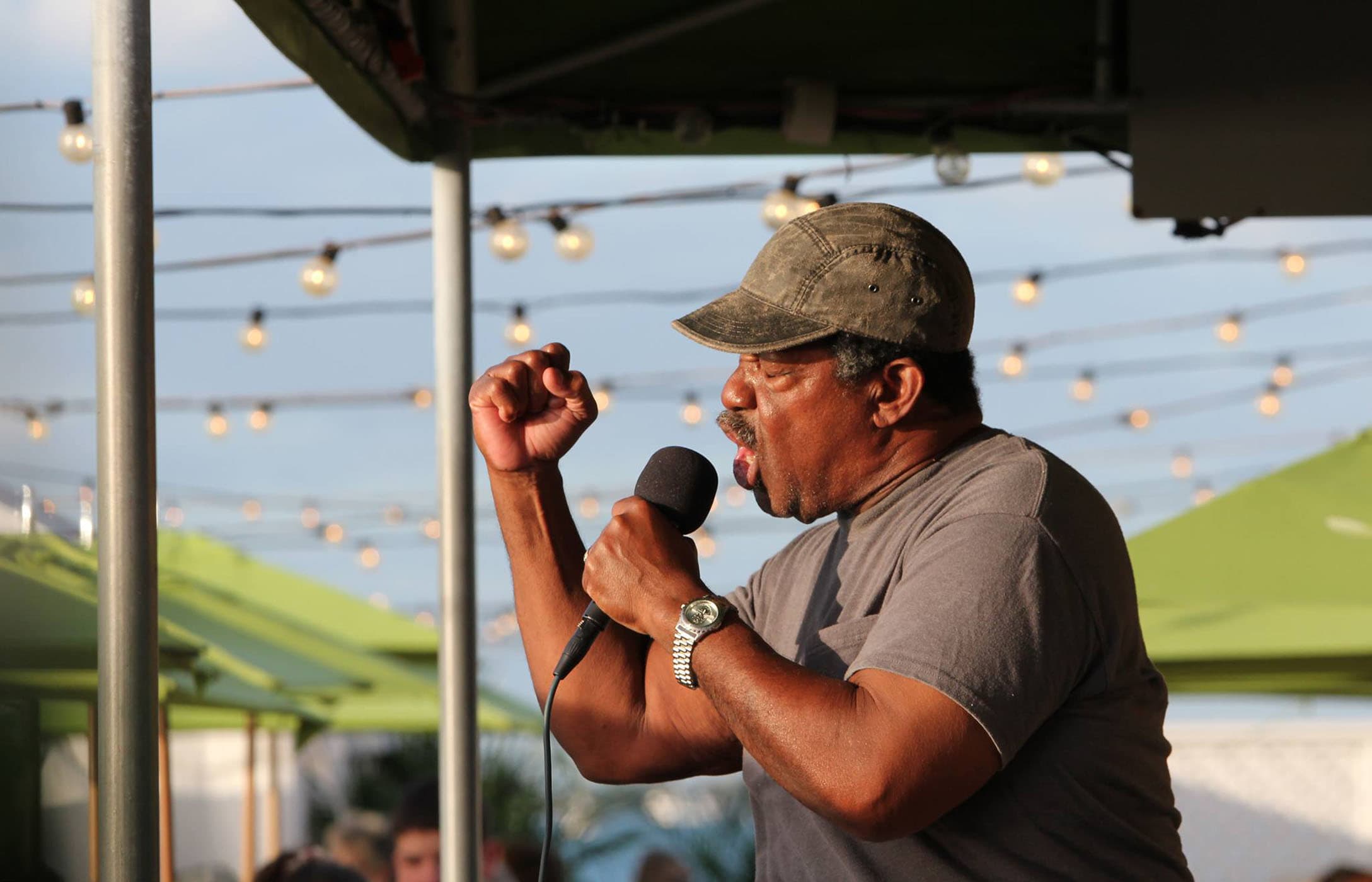 The Soul Man, Robert Albury on stage singing