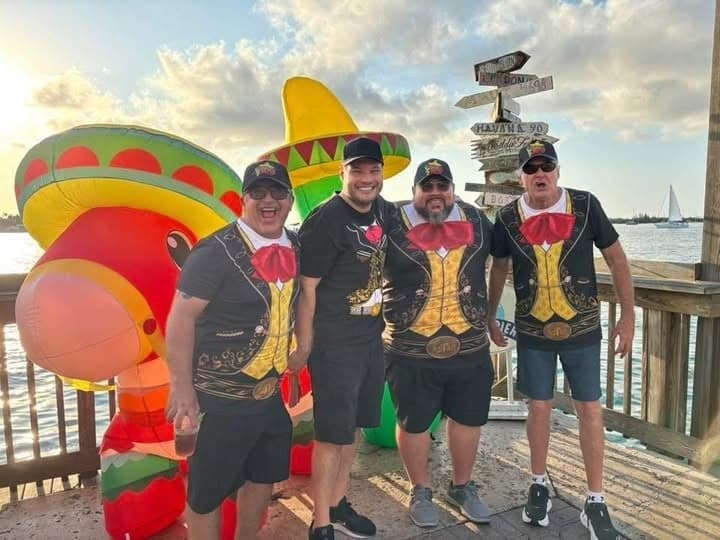 The 4 Amigos band in festive costumes at Sunset Pier, Ocean Key Resort in Key West, Florida