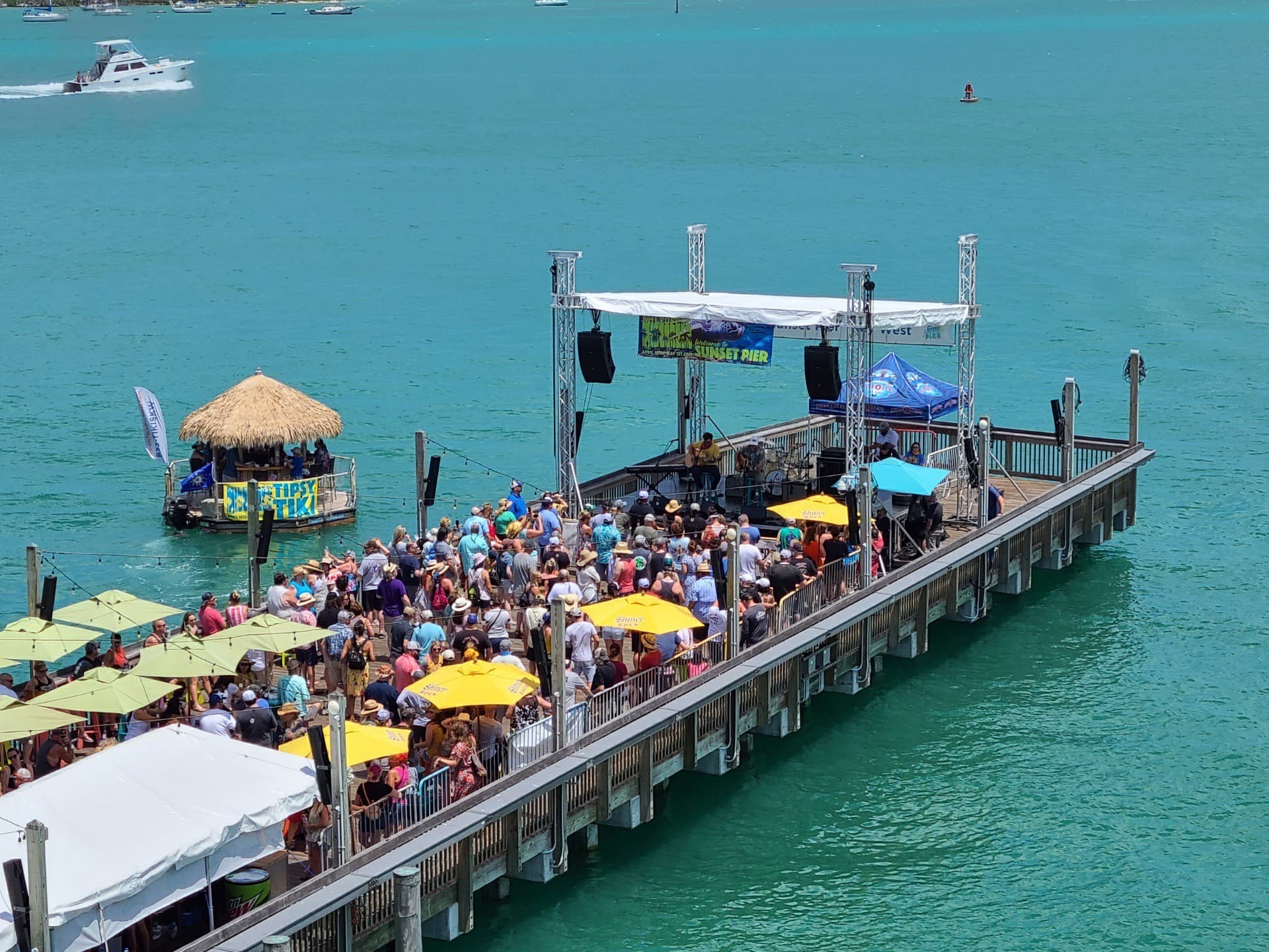 Live band performing on the Sunset Pier stage for a waterfront crowd at Ocean Key Resort, Key West, Florida