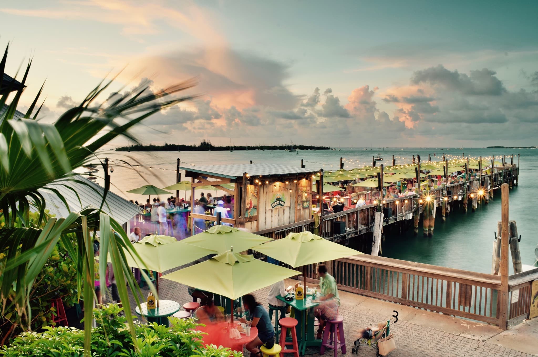 Sunset Pier waterfront dining deck at Ocean Key Resort, Key West, Florida at dusk