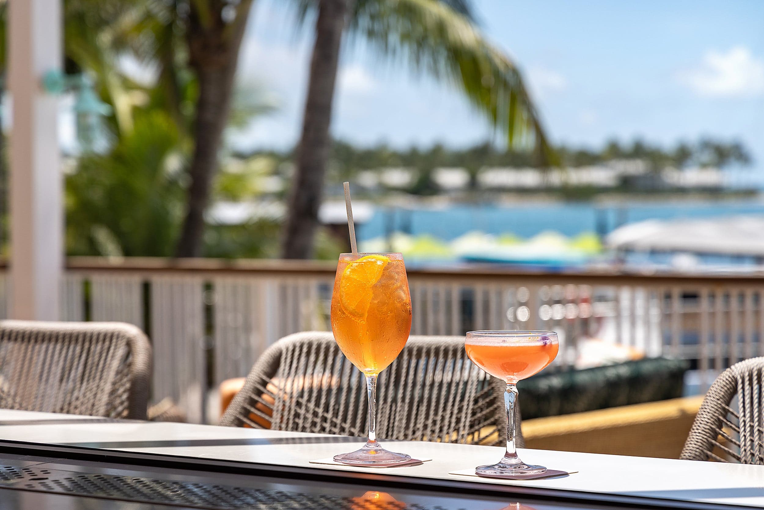 Aperol spritz and cocktail on a waterfront table at Ocean Key Resort, Key West, Florida