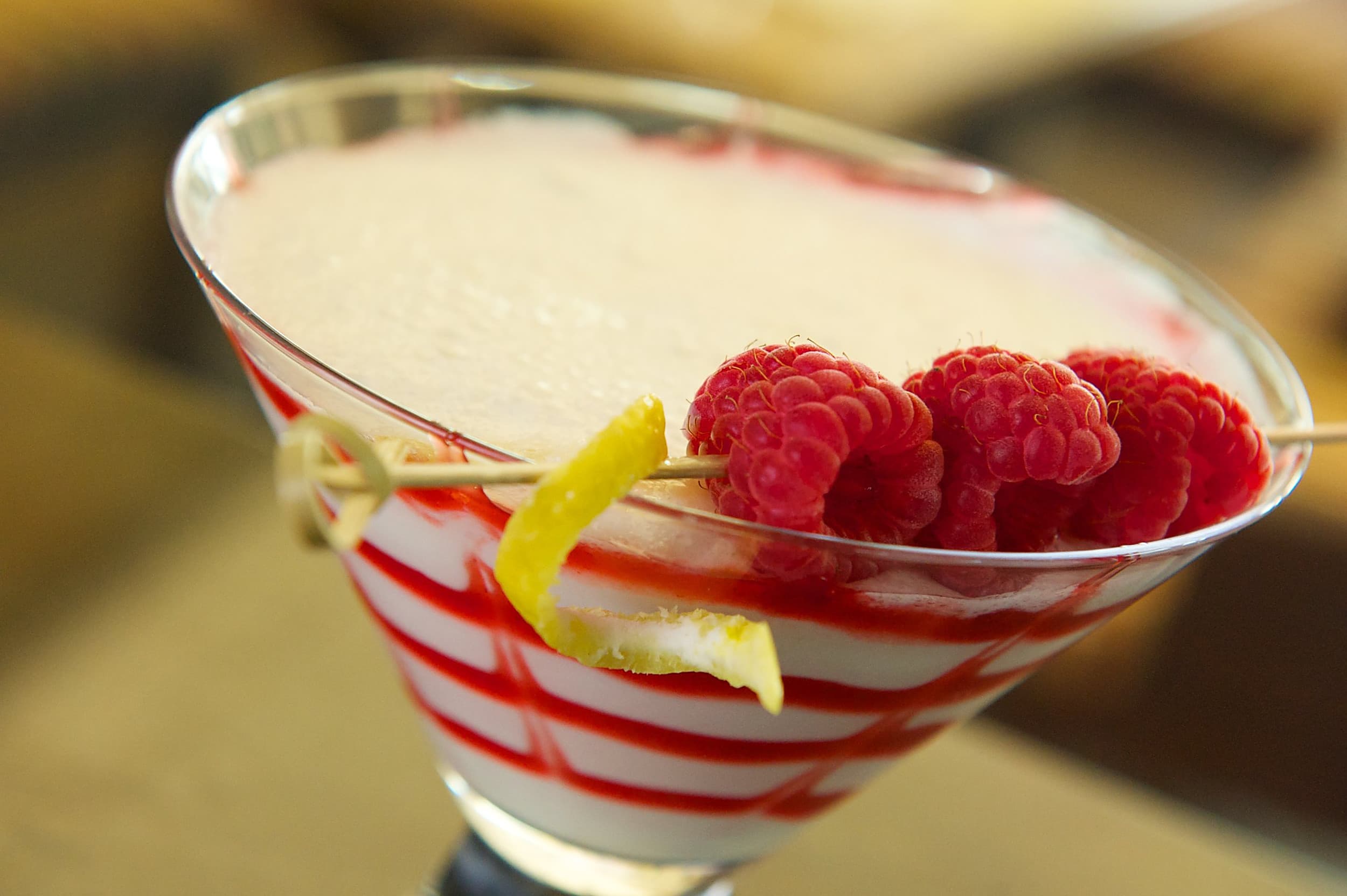 Raspberry lemon martini with a berry swirl and lemon twist garnish, served at Ocean Key Resort in Key West, Florida