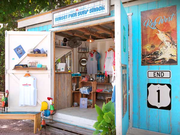 Blue shack with surfing apparel.