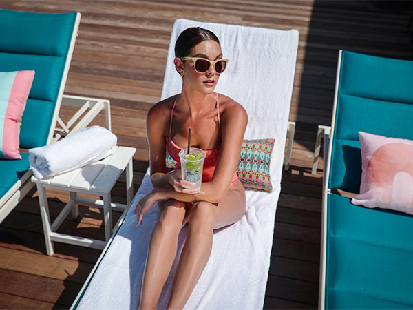 Lady With A Drink At The Pool.
