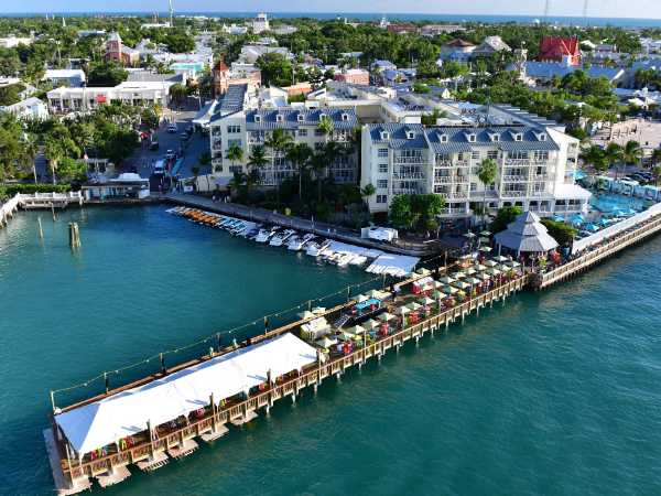 Aerial View of Ocean Key Resort with hotel and dock