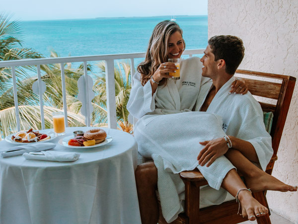Couple Dining On Their Balcony